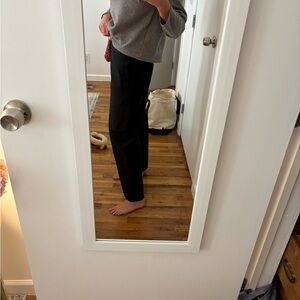 Black Buck Mason pants. Missing button (but extra buttons inside!)